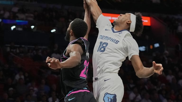 Memphis Grizzlies forward Olivier-Maxence Prosper (18) goes to the basket...