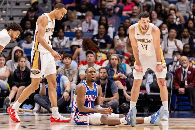Feb 21, 2026; New Orleans, Louisiana, USA; Philadelphia 76ers guard Tyrese Maxey (0) reacts to a play against New Orleans Pelicans forward/center Karlo Matković (17) and guard Bryce McGowens (11) during the second half at Smoothie King Center.