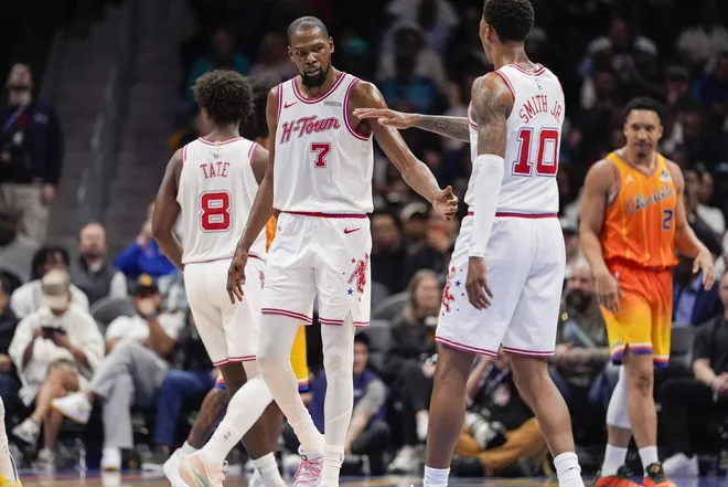 Feb 19, 2026; Charlotte, North Carolina, USA; Houston Rockets forward Kevin Durant (7)reacts with forward Jabari Smith Jr. (10) after a foul call during the second quarter against the Charlotte Hornets at Spectrum Center.