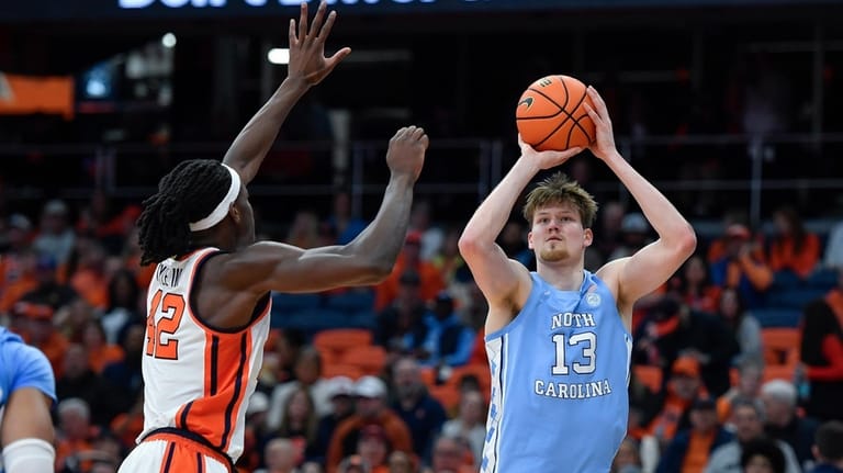 North Carolina center Henri Veesaar (13) shoots over Syracuse forward...