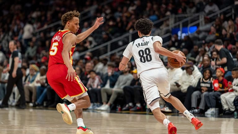 Atlanta Hawks guard Dyson Daniels (5) defends the goal against...