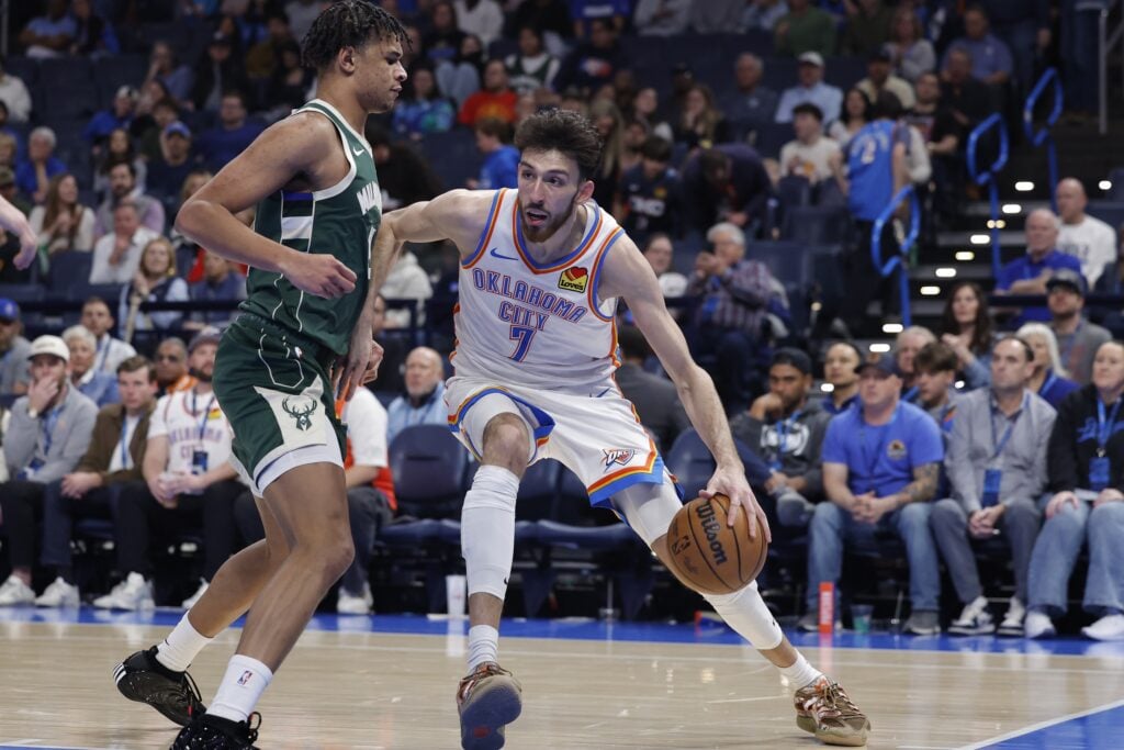 Oklahoma City Thunder center/forward Chet Holmgren (7) drives to the basket as Milwaukee Bucks forward Ousmane Dieng (21) defends during the second half at Paycom Center.