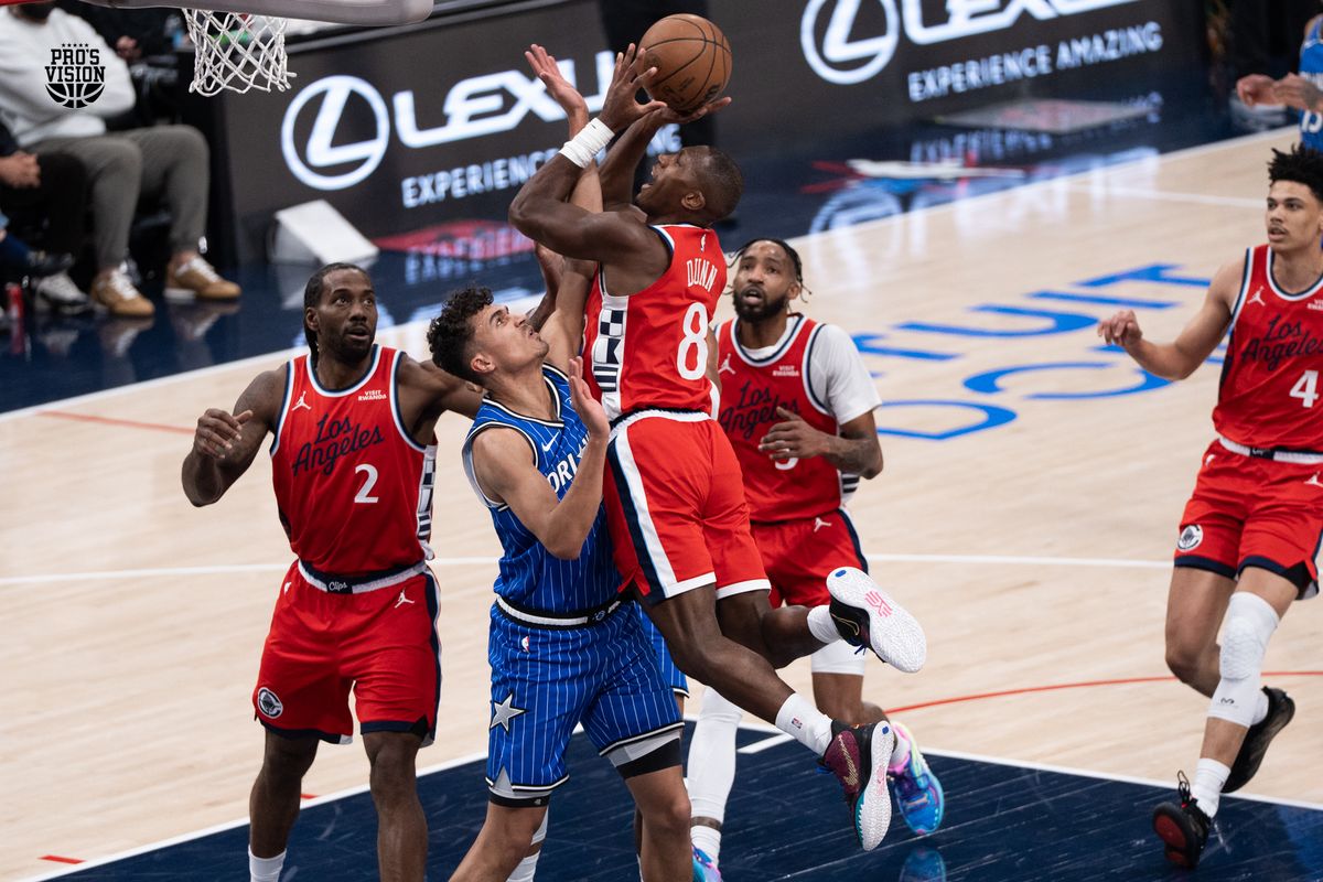 Los Angeles Clippers Guard Kris Dunn (8) drives in and shoots a tough shot over his defender during a NBA game against the Orlando Magic on Sunday, February 22, 2026 at Intuit Dome in Inglewood Calif