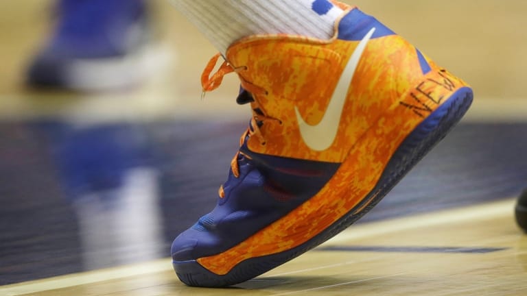 Nike sneakers are seen during the second half of an...