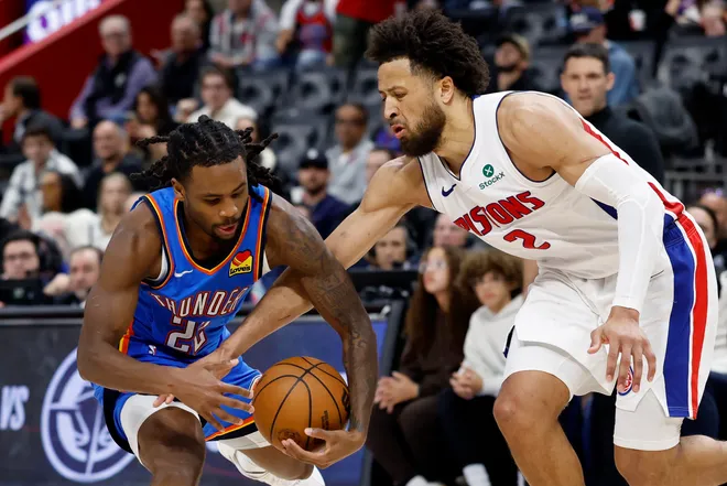 Feb 25, 2026; Detroit, Michigan, USA; Detroit Pistons guard Cade Cunningham (2) strips the ball from Oklahoma City Thunder guard Cason Wallace (22) in the second half at Little Caesars Arena. Mandatory Credit: Rick Osentoski-Imagn Images