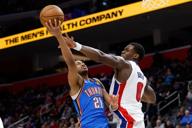 Feb 25, 2026; Detroit, Michigan, USA; Detroit Pistons center Jalen Duren (0) fouls Oklahoma City Thunder guard Aaron Wiggins (21) in the second half at Little Caesars Arena. Mandatory Credit: Rick Osentoski-Imagn Images