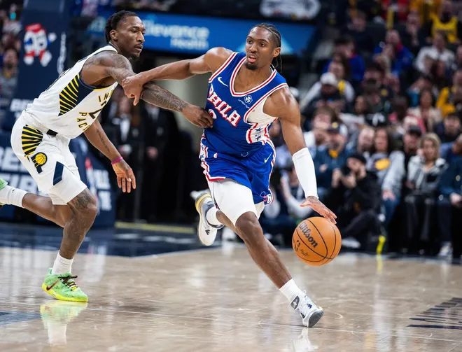 Feb 24, 2026; Indianapolis, Indiana, USA; Philadelphia 76ers guard Tyrese Maxey (0) dribbles the ball while Indiana Pacers guard Quenton Jackson (29) defends in the second half at Gainbridge Fieldhouse.