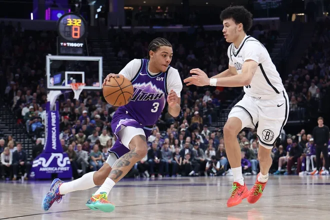 Jan 30, 2026; Salt Lake City, Utah, USA; Utah Jazz guard Keyonte George (3) drives against Brooklyn Nets guard Nolan Traore (88) during the second half at Delta Center.