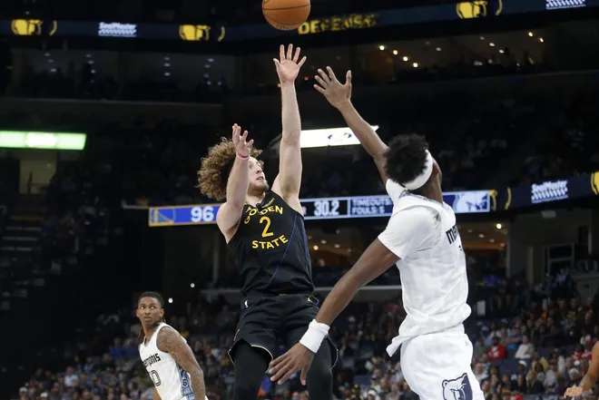 Feb 25, 2026; Memphis, Tennessee, USA; Golden State Warriors guard Brandin Podziemski (2) shoots as Memphis Grizzlies forward Olivier-Maxence Prosper (18) defends during the third quarter at FedExForum.