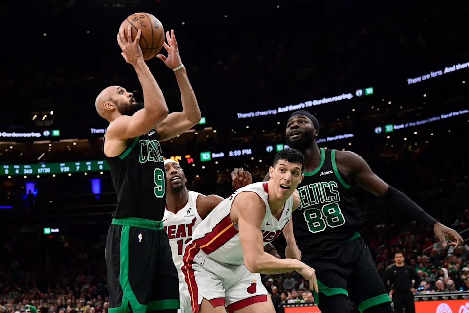 Feb 6, 2026; Boston, Massachusetts, USA; Boston Celtics guard Derrick White (9) shoots the ball during the second half against the Miami Heat at TD Garden. Mandatory Credit: Bob DeChiara-Imagn Images