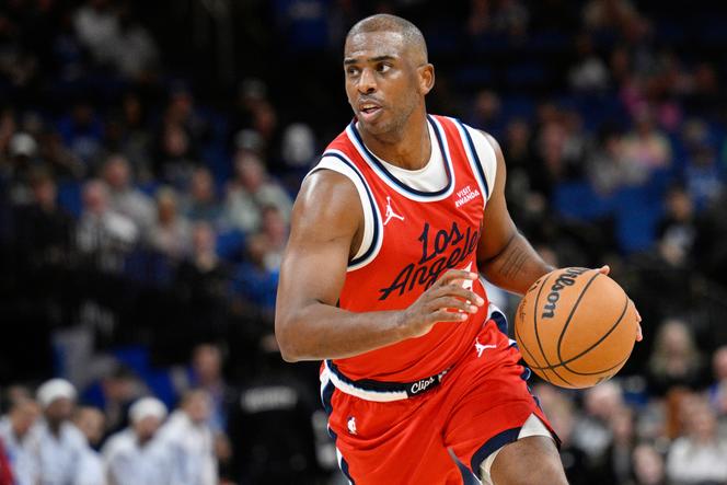 Los Angeles Clippers guard Chris Paul drives to the basket during the second half of an NBA basketball game against the Orlando Magic, on November 20, 2025, in Orlando, Florida.