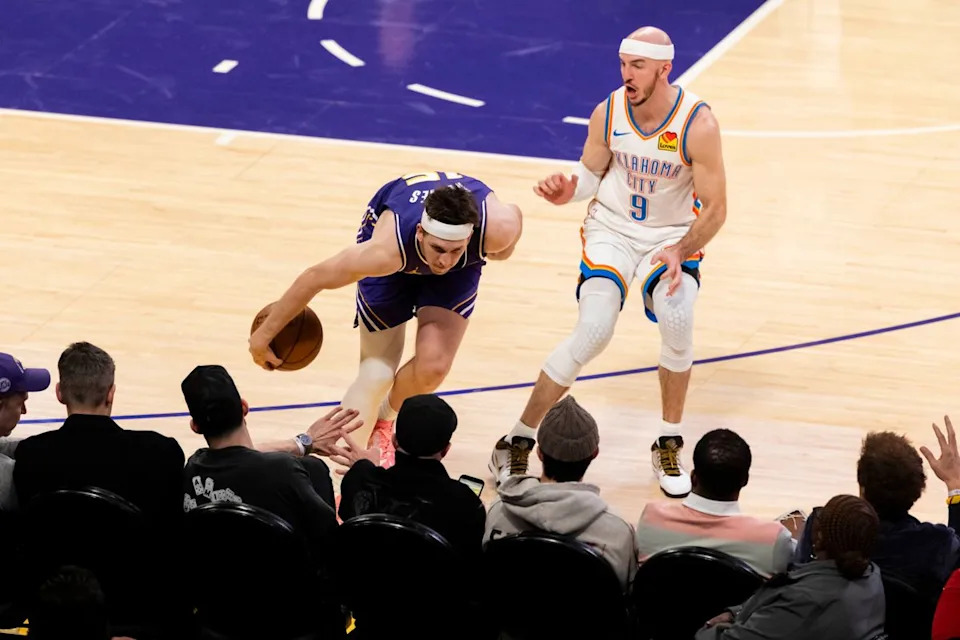 Austin Reaves #15 of the Los Angeles Lakers saves the ball from going out of bounds during an NBA basketball game against the Oklahoma City Thunder, Monday February 9, 2026 in Los Angeles, Calif.