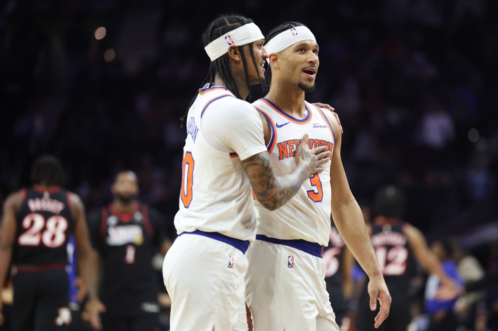 New York Knicks guard Jordan Clarkson (00) and guard Josh Hart (3) talk during a timeout in the second half against the Philadelphia 76ers at Xfinity Mobile Arena.