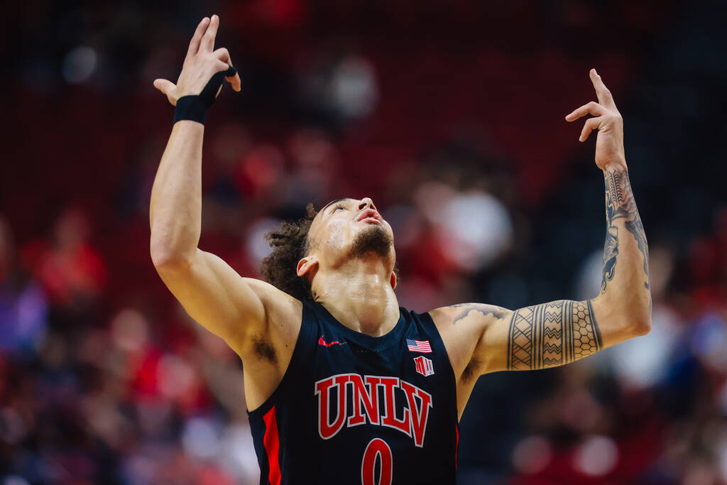 Rebels guard Dra Gibbs-Lawhorn (0) celebrates in an NCAA basketball game against the Grand Cany ...