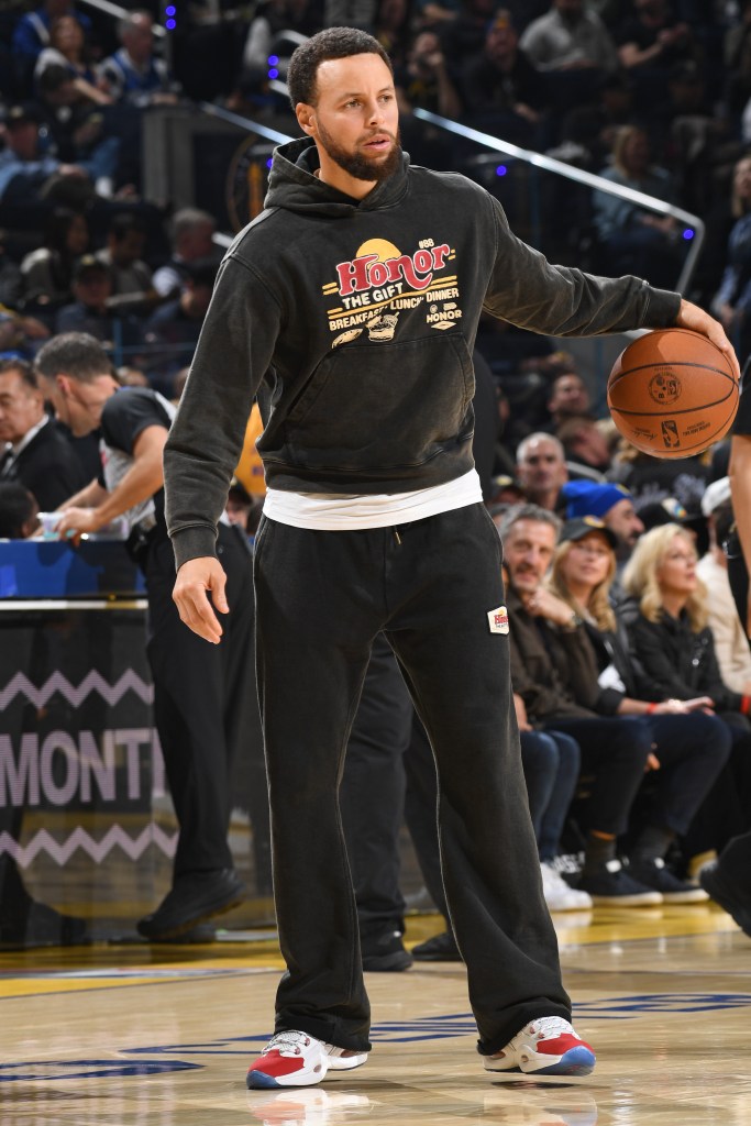 Warriors star Steph Curry warms up before an NBA game.