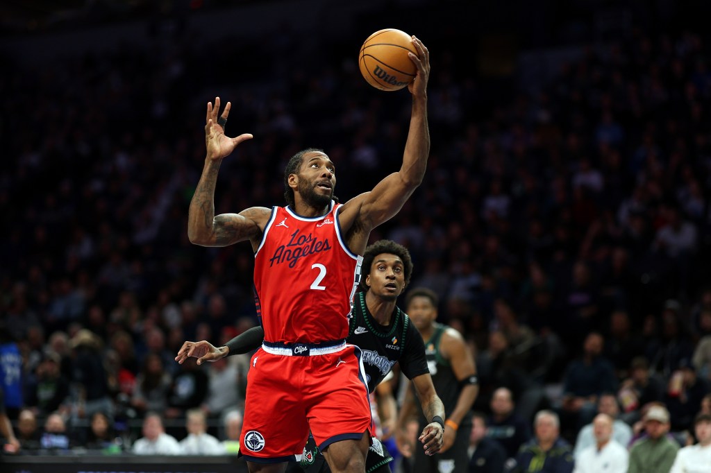 Kawhi Leonard #2 of the Los Angeles Clippers goes to the basket against Jaden McDaniels #3 of the Minnesota Timberwolves in the second quarter at Target Center on February 08, 2026 in Minneapolis, Minnesota. 