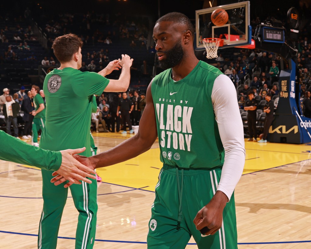 Jaylen Brown #7 of the Boston Celtics high fives teammate before the game against the Golden State Warriors on February 19, 2026 at Chase Center in San Francisco, California.
