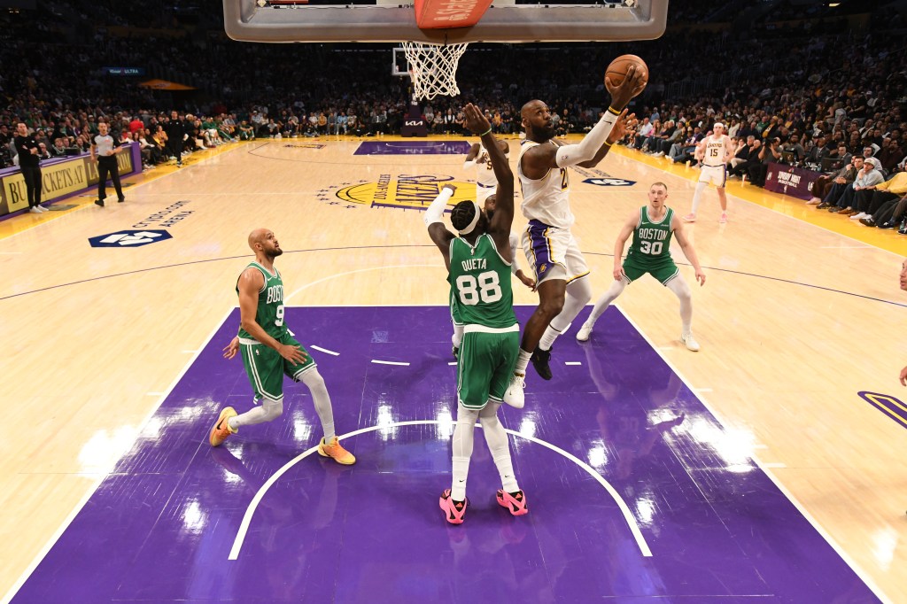 LeBron James #23 drives to the basket during a game between the Los Angeles Lakers and the Boston Celtics.