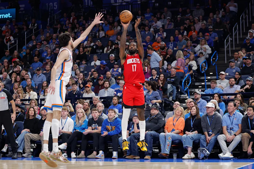 Feb 7, 2026; Oklahoma City, Oklahoma, USA; Houston Rockets forward Tari Eason (17) shoots a three point basket as Oklahoma City Thunder center/forward Chet Holmgren (7) defends during the second half at Paycom Center. Mandatory Credit: Alonzo Adams-Imagn Images