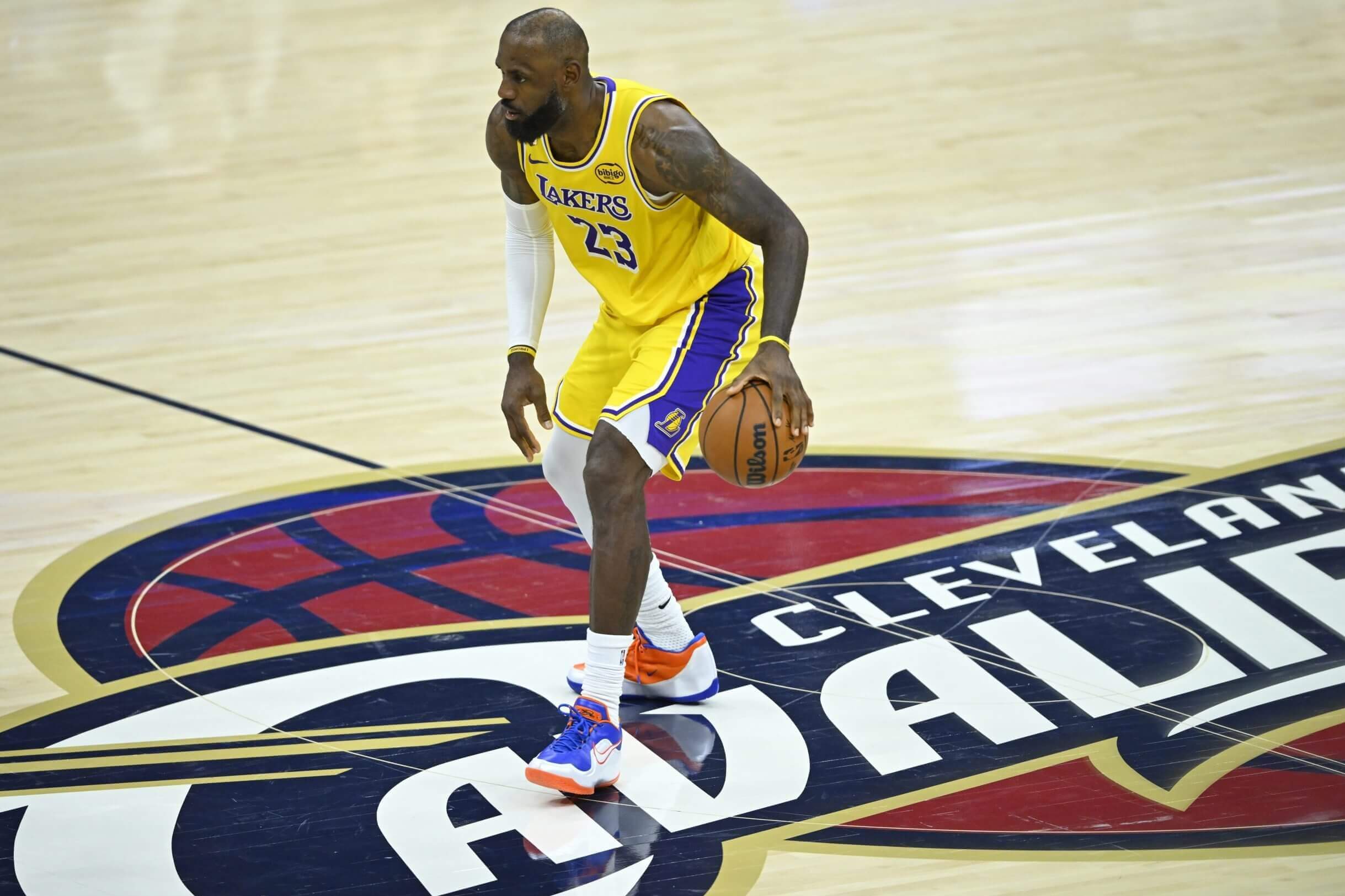 LeBron James dribbles at half court in Cleveland
