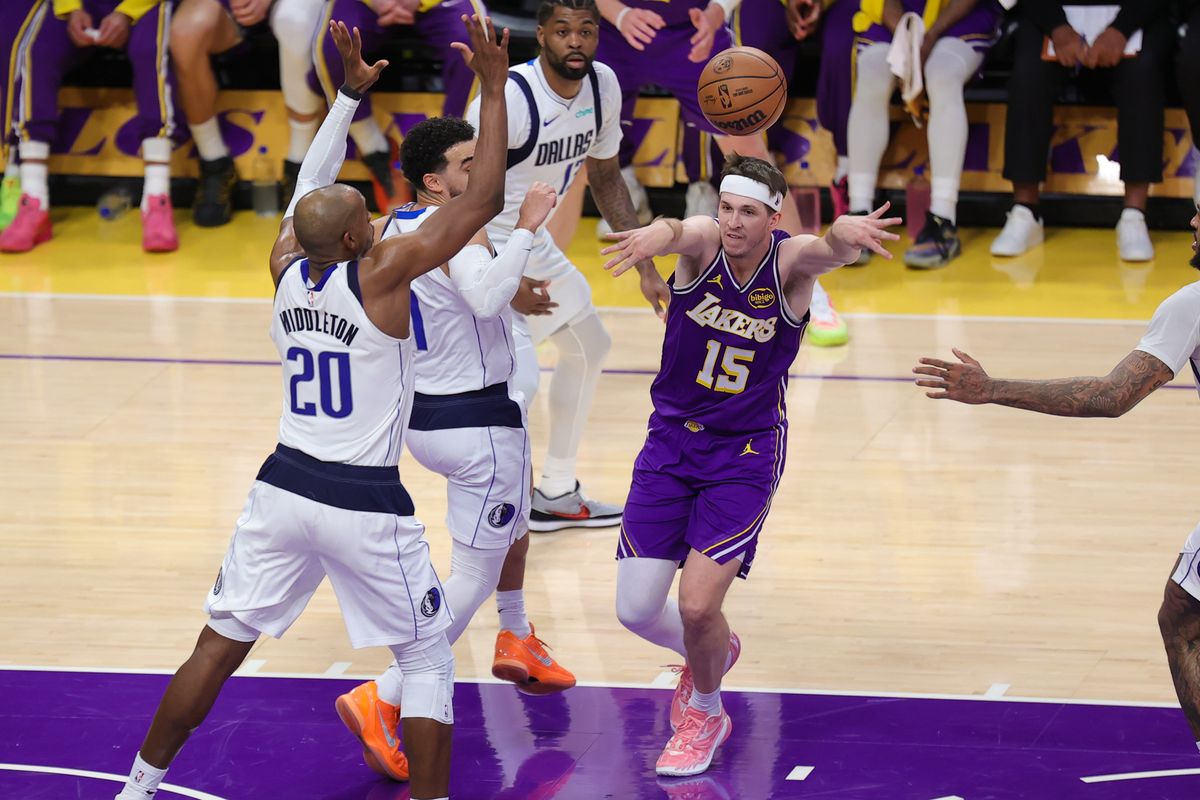 Los Angeles Lakers guard Austin Reaves (15) passes the basketball during an NBA game against the Dallas Mavericks on February 12, 2026 in Los Angeles, CA.