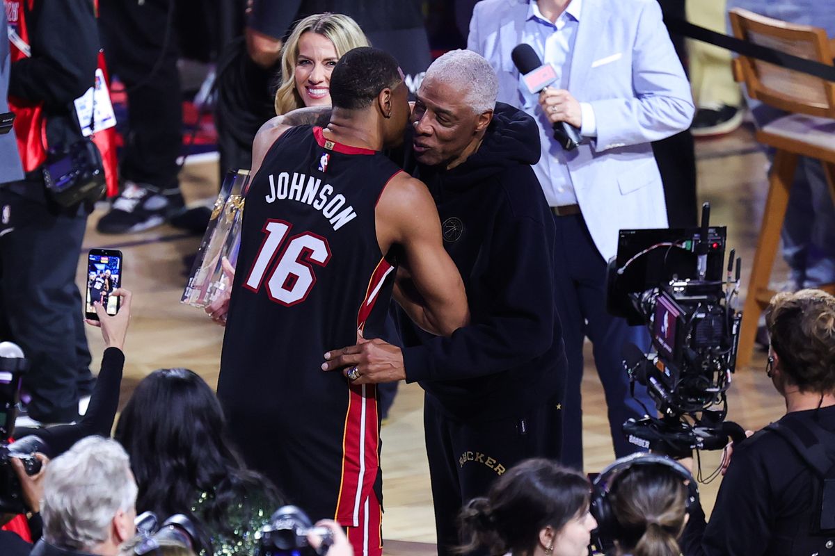 Miami Heat forward Keshad Johnson (16) and NBA Hall of Famer Julius Irving embrace after winning the slam dunk contest at NBA All Star Saturday on February 14, 2026 in Inglewood, CA.