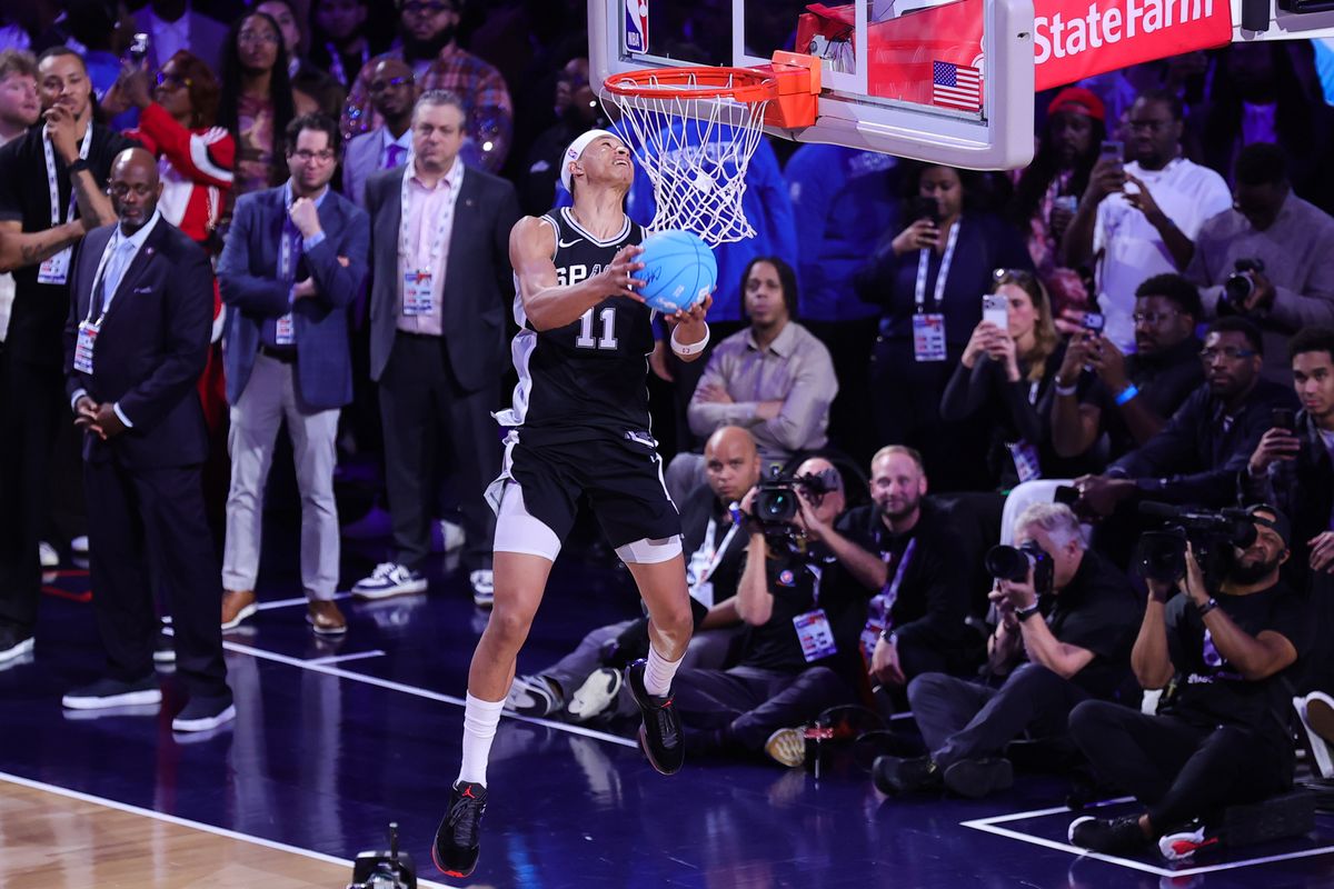 San Antonio Spurs forward Carter Bryant (11) participates in the slam dunk contest at NBA All Star Saturday on February 14, 2026 in Inglewood, CA.