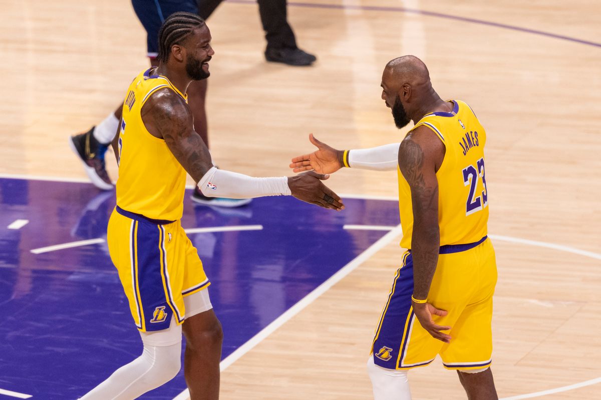 Deandre Ayton #5 and LeBron James #23 of the Los Angeles Lakers high five during an NBA basketball game against the LA Clippers, Friday February 20, 2026 in Los Angeles, Calif.