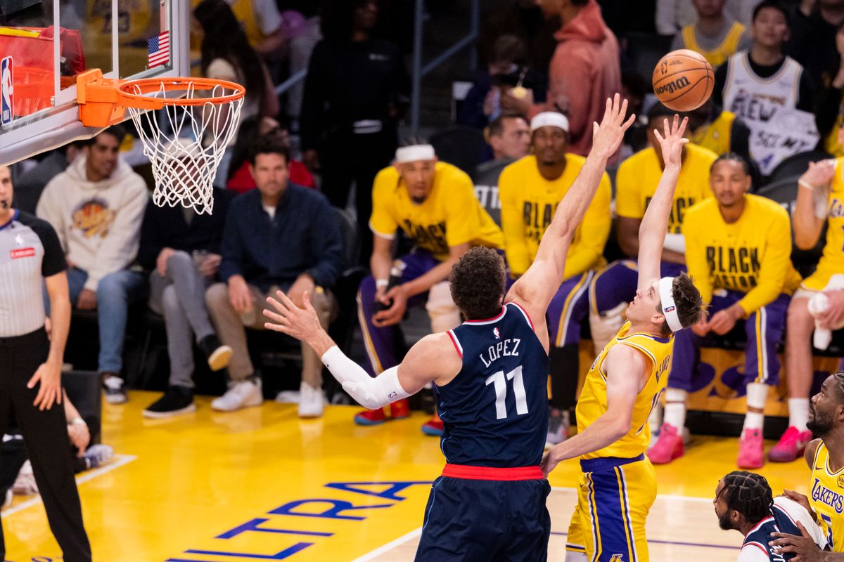 Austin Reaves #15 of the Los Angeles Lakers shoots the ball over Brook Lopez #11 of the LA Clippers during an NBA basketball game, Friday February 20, 2026 in Los Angeles, Calif.