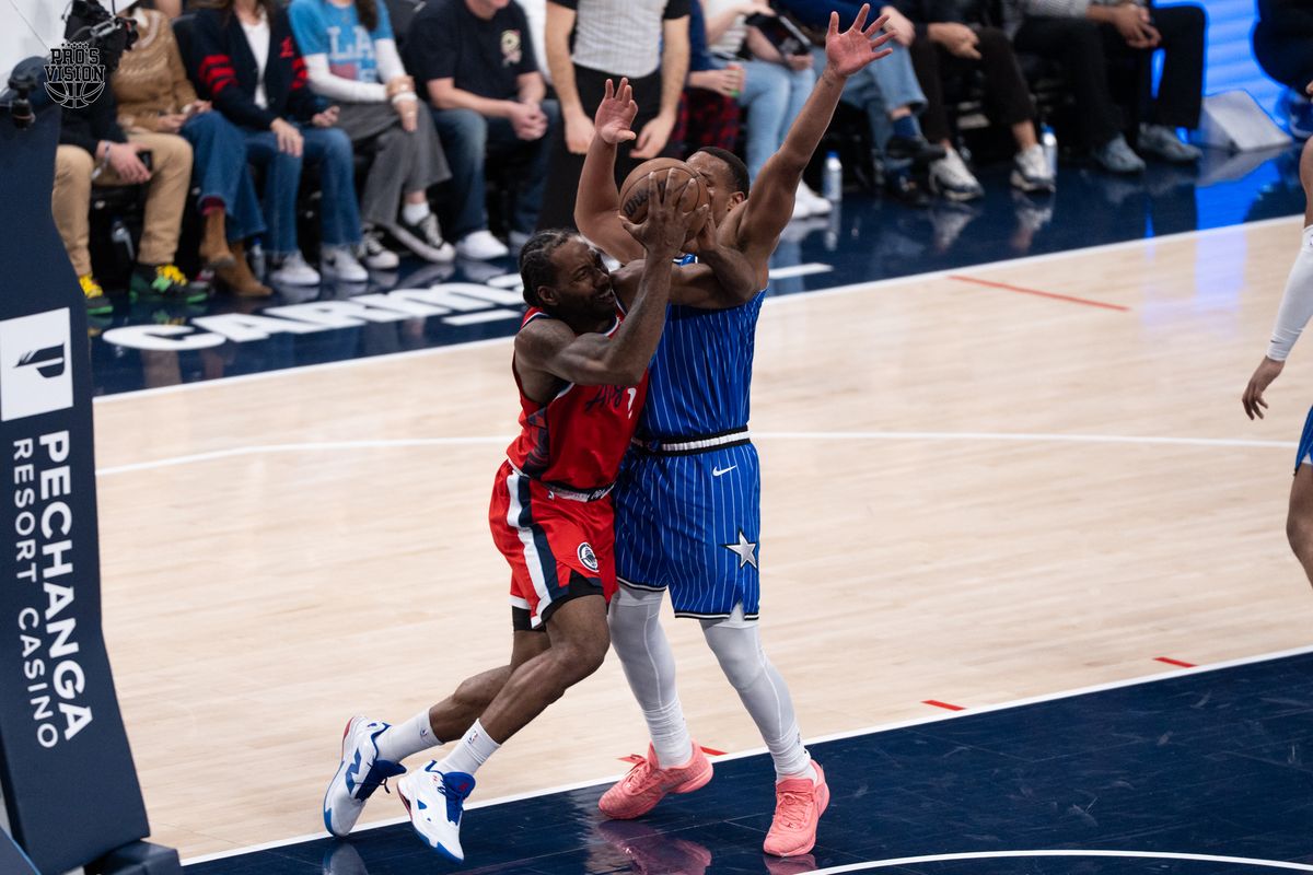 Los Angeles Clippers Guard Kawhii Leonard (2) attacks baseline and collide with his defender during a NBA game against the Orlando Magic on Sunday, February 22, 2026 at Intuit Dome in Inglewood Calif