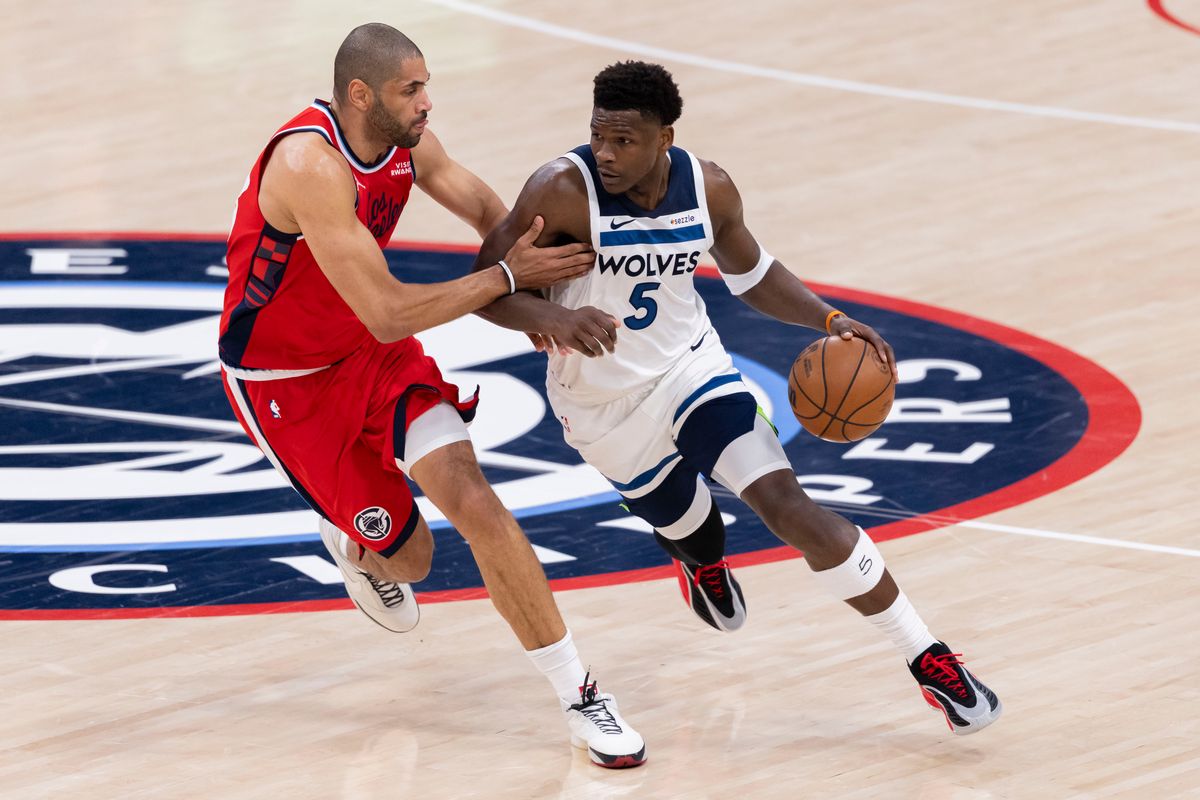 Anthony Edwards #5 of the Minnesota Timberwolves handles the ball against Nicolas Batum #33 of the LA Clippers during an NBA basketball game, Thursday February 26, 2026 in Inglewood, Calif.