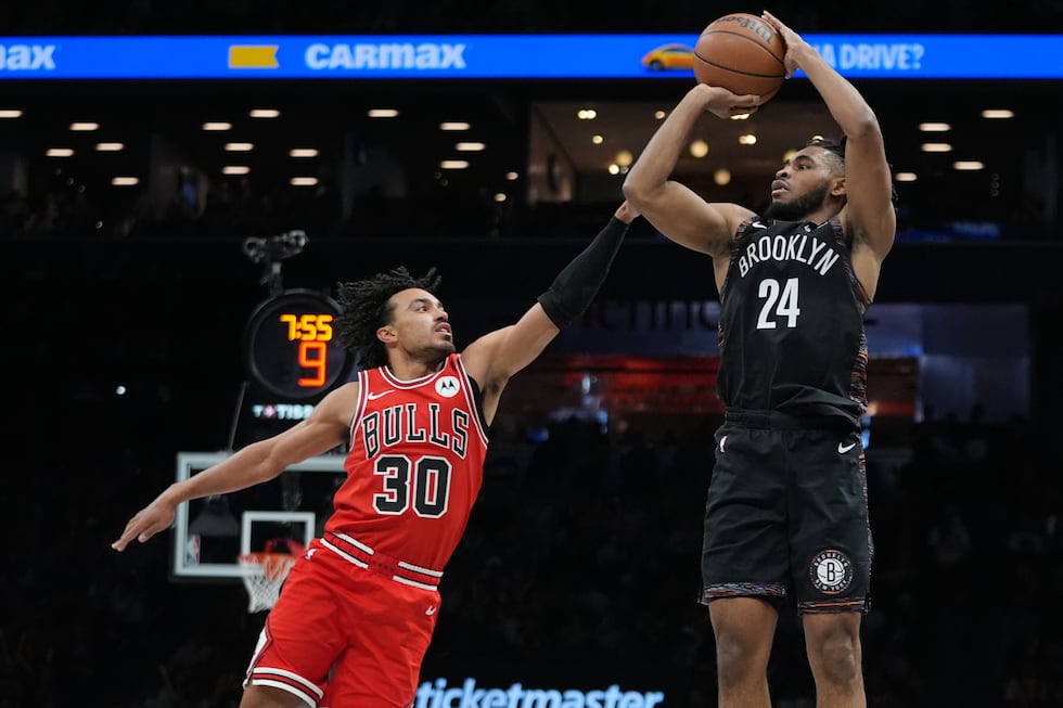Brooklyn Nets' Cam Thomas (24) shoots over Chicago Bulls' Tre Jones (30) during the second...