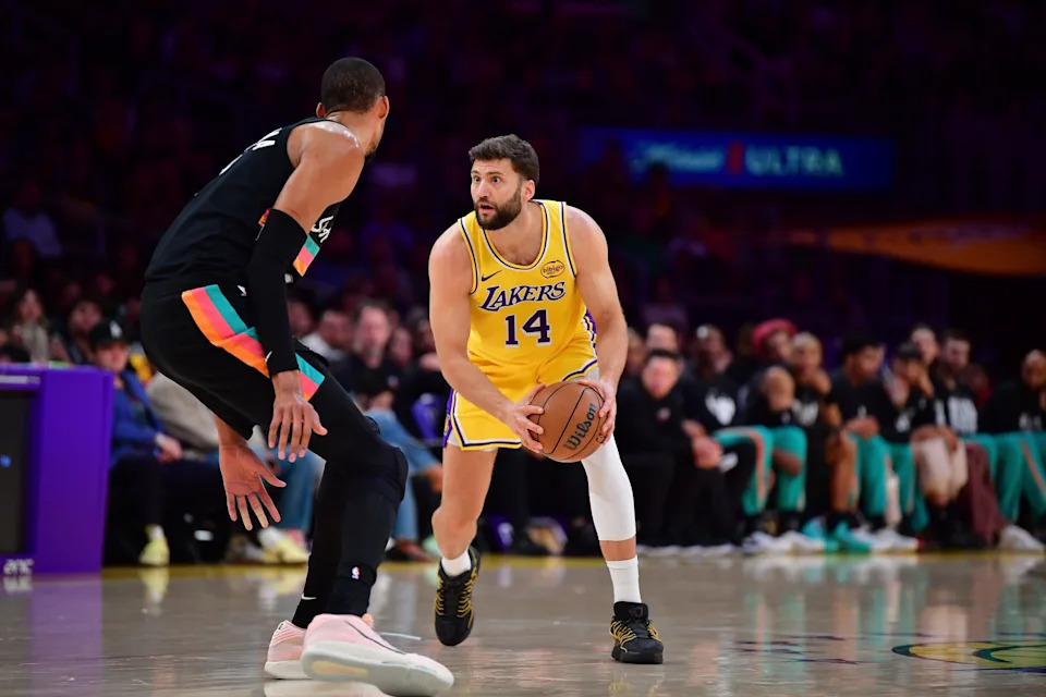Feb 10, 2026; Los Angeles, California, USA; Los Angeles Lakers forward Maxi Kleber (14) controls the ball against San Antonio Spurs forward Victor Wembanyama (1) during the first half at Crypto.com Arena. Mandatory Credit: Gary A. Vasquez-Imagn Images