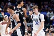 Dallas Mavericks forward Cooper Flagg (32) looks at San Antonio Spurs forward/center Victor...