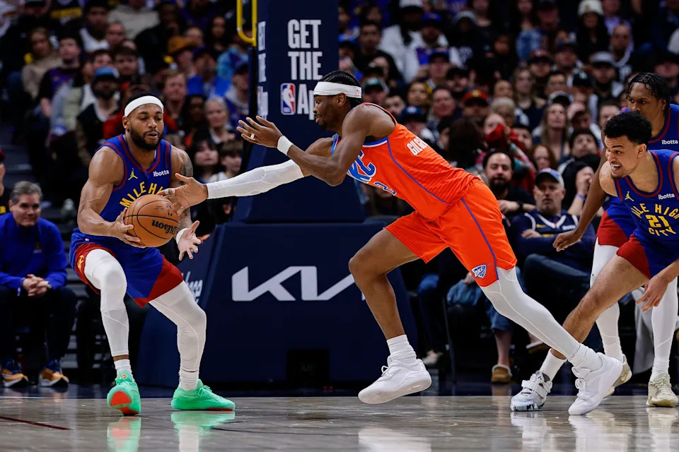 Feb 1, 2026; Denver, Colorado, USA; Denver Nuggets guard Bruce Brown (11) and Oklahoma City Thunder guard Shai Gilgeous-Alexander (2) battle for a loose ball in the fourth quarter at Ball Arena. Mandatory Credit: Isaiah J. Downing-Imagn Images