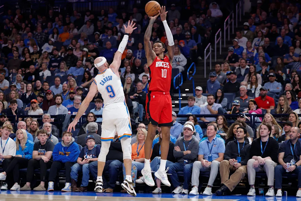 Feb 7, 2026; Oklahoma City, Oklahoma, USA; Houston Rockets forward Jabari Smith Jr. (10) shoots over Oklahoma City Thunder guard Alex Caruso (9) during the second half at Paycom Center. Mandatory Credit: Alonzo Adams-Imagn Images
