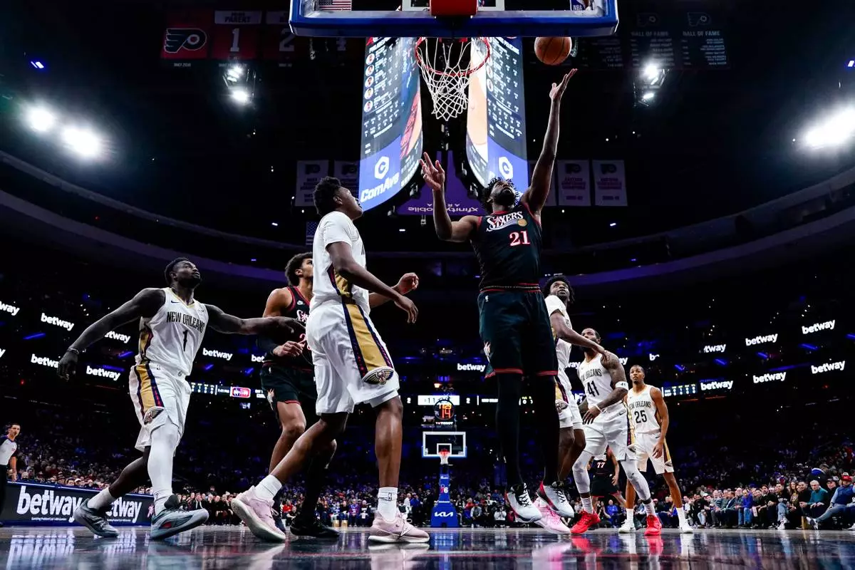Philadelphia 76ers' Joel Embiid, center right, shoots during the first half of an NBA basketball game against the New Orleans Pelicans, Saturday, Jan. 31, 2026, in Philadelphia. (AP Photo/Chris Szagola)