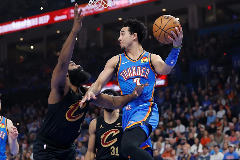Feb 22, 2026; Oklahoma City, Oklahoma, USA; Oklahoma City Thunder guard Jared McCain (3) passes around Cleveland Cavaliers guard James Harden (1) during the first half at Paycom Center. Mandatory Credit: Alonzo Adams-Imagn Images