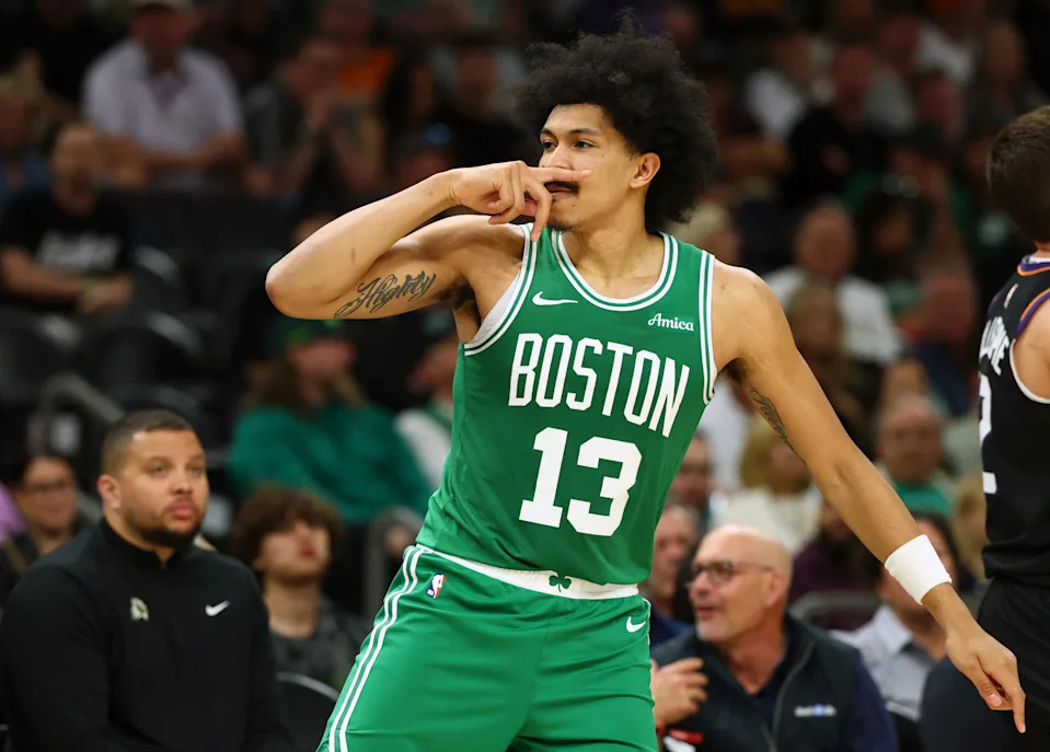 Feb 24, 2026; Phoenix, Arizona, USA; Boston Celtics guard Ron Harper Jr. (13) celebrates a three point shot against the Phoenix Suns in the second half at Mortgage Matchup Center. Mandatory Credit: Mark J. Rebilas-Imagn Images