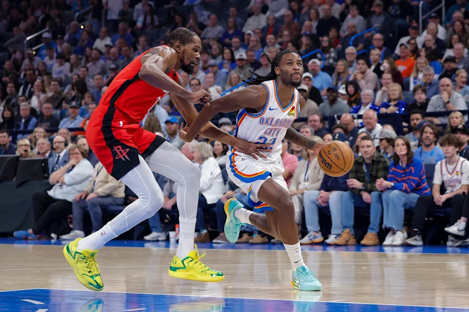 Feb 7, 2026; Oklahoma City, Oklahoma, USA; Oklahoma City Thunder guard Cason Wallace (22) drives past Houston Rockets forward Kevin Durant (7) during the first half at Paycom Center. Mandatory Credit: Alonzo Adams-Imagn Images