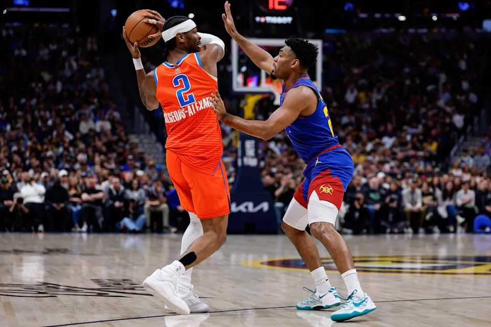 Feb 1, 2026; Denver, Colorado, USA; Oklahoma City Thunder guard Shai Gilgeous-Alexander (2) controls the ball as Denver Nuggets guard Jalen Pickett (24) guards in the first quarter at Ball Arena. Mandatory Credit: Isaiah J. Downing-Imagn Images