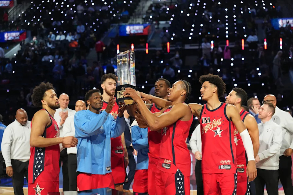 Feb 15, 2026; Inglewood, California, USA; Team USA Stars guard Cade Cunningham (2) of the Detroit Pistons, guard Anthony Edwards (5) of the Minnesota Timberwolves, center Chet Holmgren (7) of the Oklahoma City Thunder, center Jalen Duren (0) of the Detroit Pistons, forward Scottie Barnes (4) of the Toronto Raptors and forward Jalen Johnson (1) of the Atlanta Hawks, left to right, lift the trophy after defeating Team Stripes during the 75th NBA All Star Game at Intuit Dome. Mandatory Credit: Kirby Lee-Imagn Images