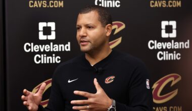 Cleveland Cavaliers forward De'Andre Hunter, right, celebrates with teammate Darius Garland, left, after a basket in the first half of an NBA basketball game against the Minnesota Timberwolves, Monday, Feb. 10, 2025, in Cleveland