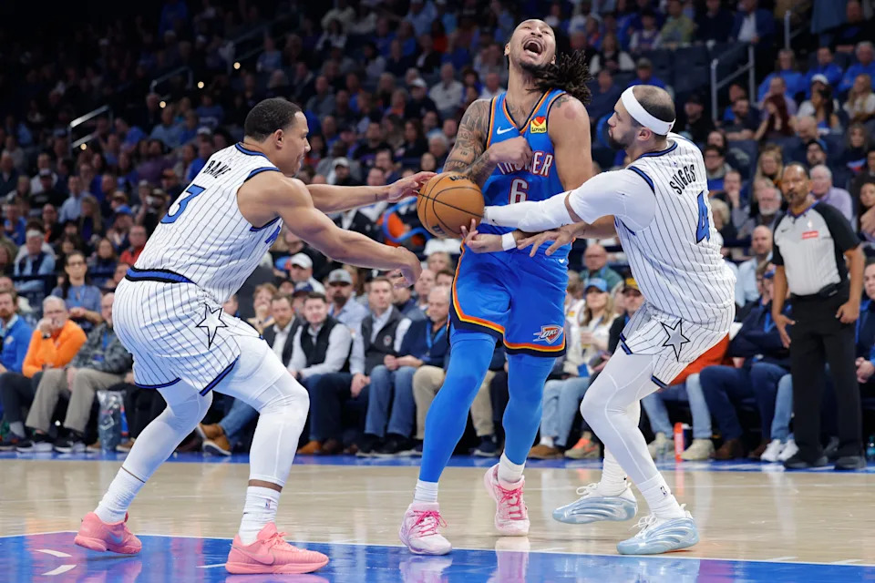 Feb 3, 2026; Oklahoma City, Oklahoma, USA; Oklahoma City Thunder forward Jaylin Williams (6) has the ball stopped away during a drip to the basket between Orlando Magic guard Jett Howard (13) and Orlando Magic guard Jalen Suggs (4) during the second half at Paycom Center. Mandatory Credit: Alonzo Adams-Imagn Images