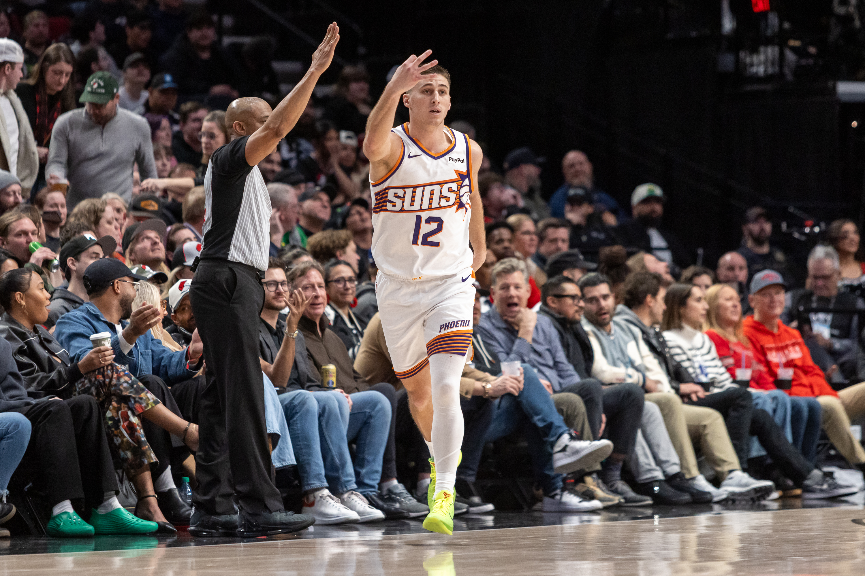 Phoenix Suns guard Collin Gillespie reacts toward the bench after knocking down a three-pointer during an NBA game against the Portland Trail Blazers at Moda Center on Tuesday, Feb. 3, 2026.