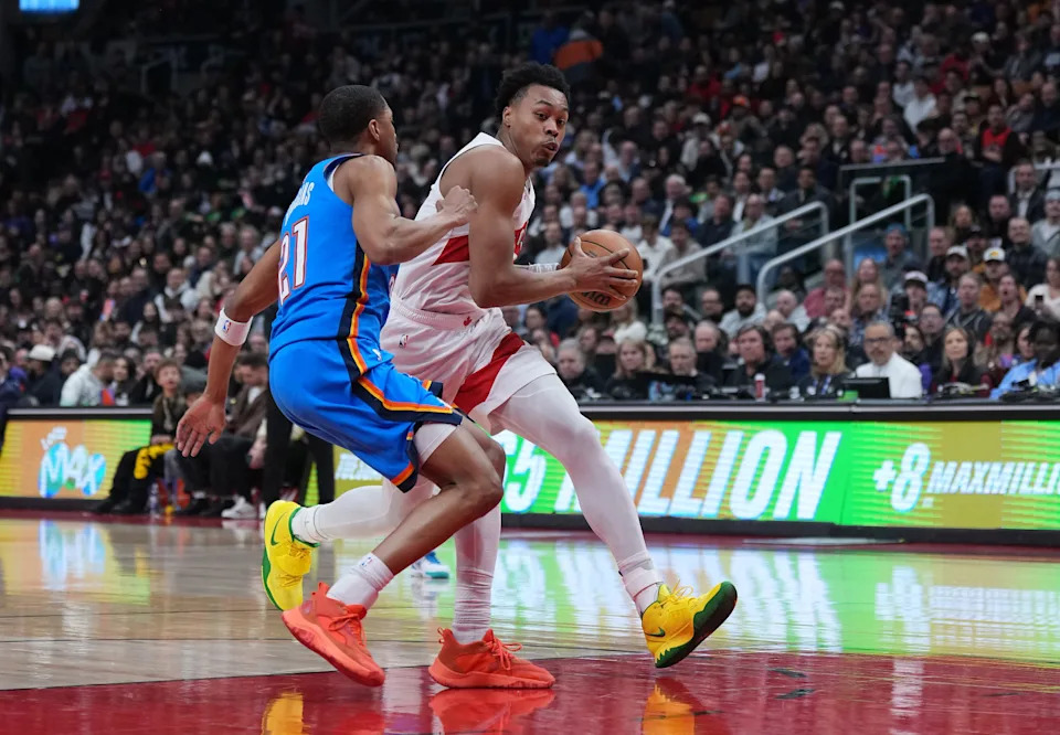 Feb 24, 2026; Toronto, Ontario, CAN; Toronto Raptors forward Scottie Barnes (4) drives against Oklahoma City Thunder guard Aaron Wiggins (21) during the first quarter at Scotiabank Arena. Mandatory Credit: Nick Turchiaro-Imagn Images
