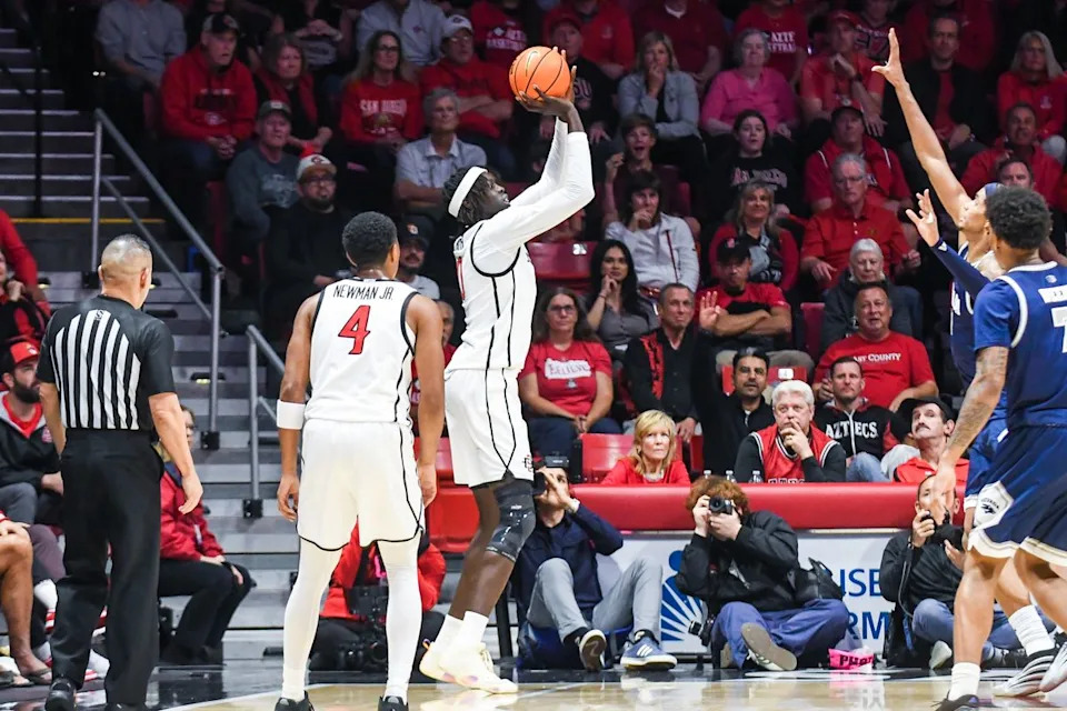 SDSU forward Magoon Gwath (0) shoots a 3PT jump shot during an NCAA Basketball game against Nevada Saturday February 14, 2026 in California.
