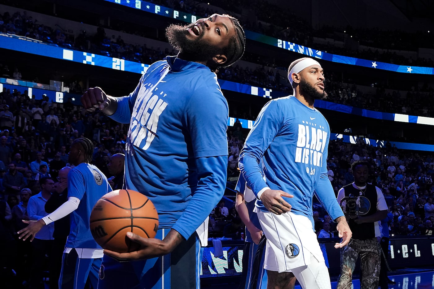 Dallas Mavericks forward Naji Marshall (left) reacts as forward Daniel Gafford is introduced...