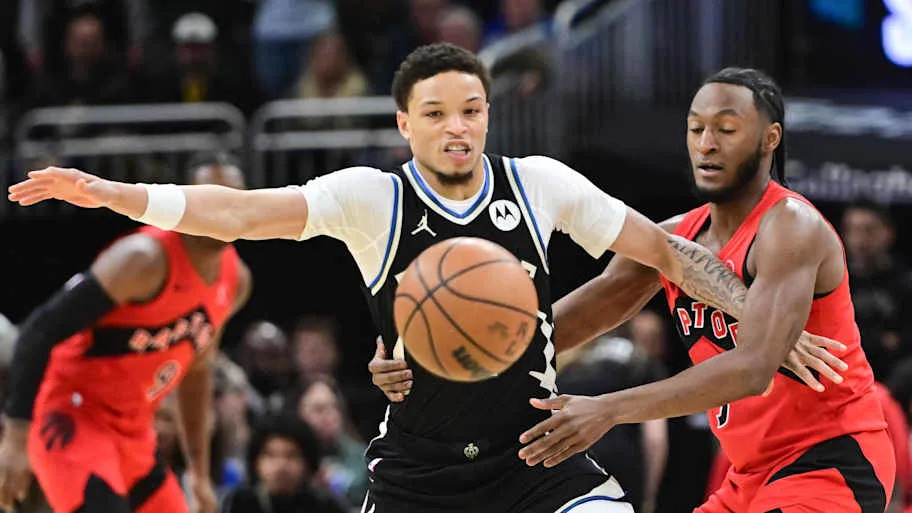 Milwaukee Bucks guard Ryan Rollins and Toronto Raptors guard Immanuel Quickley