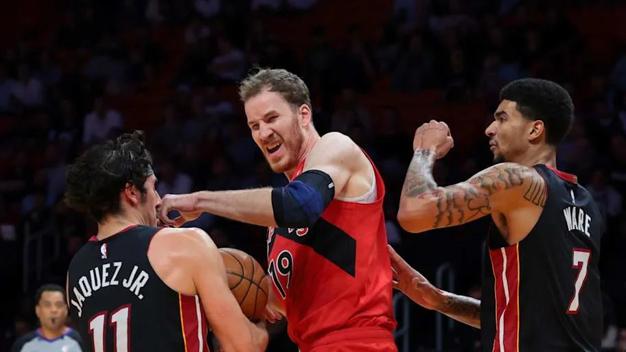 Miami Heat forward Jaime Jaquez Jr. grabs a rebound against Toronto Raptors center Jakob Poeltl